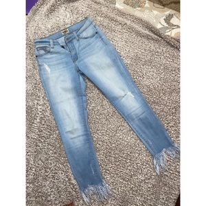 Light jeans with frayed ends